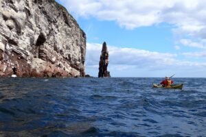 Simon approaching the leaning sea stack